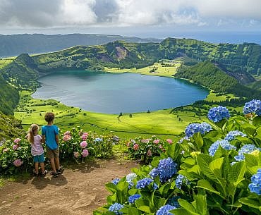 Sete Cidades on São Miguel Island is one of the most iconic Azores landscapes, where families can stand inside a volcanic crater overlooking twin lakes of emerald green and deep blue.