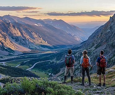 Family standing at Rock Creek Vista on the Beartooth Highway in the Beartooth Mountains Montana, scenic high-alpine overlook suitable for visiting the Beartooth Mountains with kids.