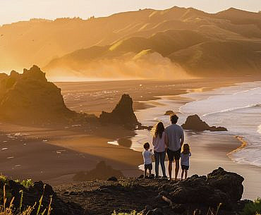 Family overlooking Black Sands Beach on the Lost Coast in California during an outdoor adventure family trip.