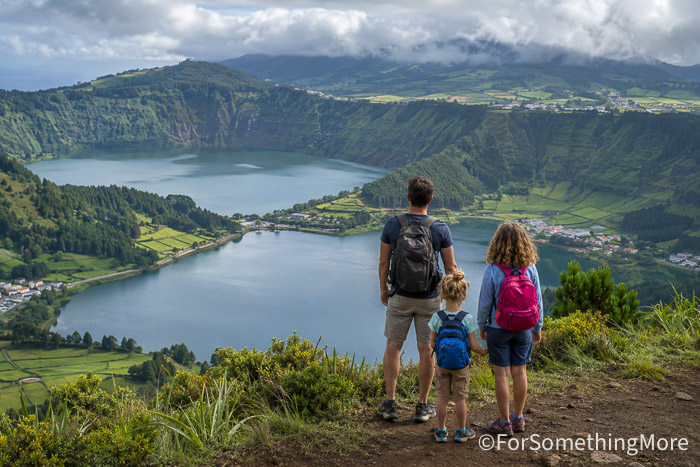 Family overlooking Sete Cidades lakes in the Azores, one of the best family adventure destinations for outdoor travel.

