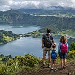 Family overlooking Sete Cidades lakes in the Azores, one of the best family adventure destinations for outdoor travel.