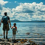Family overlooking Rangeley Lake while exploring things to do in Rangeley Maine with kids.