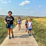 Multigenerational family visiting the Theodore Roosevelt Presidential Library with kids in Medora, North Dakota.