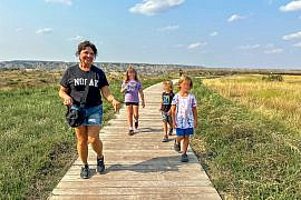 Multigenerational family visiting the Theodore Roosevelt Presidential Library with kids in Medora, North Dakota.