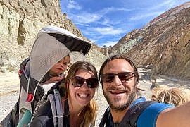 Family hiking through Gower Gulch in Death Valley National Park during a Death Valley with kids adventure.