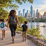 Family strolling along the waterfront during an Austin with kids outdoor adventure.